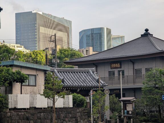 Traditional Japanese house with modern buildings
