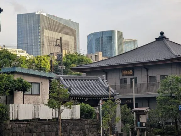Traditional Japanese house with modern buildings
